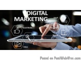 The image shows a person's hand holding a tablet with the words "Digital Marketing" written on it. The background is blurred,...