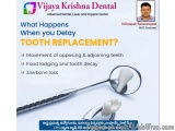 The image is an advertisement for Vijaya Krishna Dental, an advanced dental, laser and implant center. The background is whit...