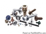 The image shows a collection of various types of screws and nuts. There are different sizes and shapes of screws, including a...