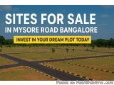 The image shows an aerial view of a road in Mysore Road Bangalore, India. The road is divided into two sections, with the lef...