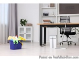 The image shows a modern office space with a wooden desk and a black office chair. The desk has a black metal frame and a woo...