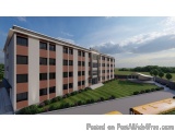 The image is a 3D rendering of a modern apartment building. The building is a two-story structure with a flat roof and large...