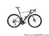 The image is of a bicycle, specifically a road bike. The bike is a light grey color with black accents and the brand name "Ar...