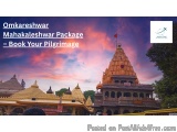 The image shows a beautiful temple complex in India. The temple is a Hindu temple with a tall, ornate structure with a pointe...