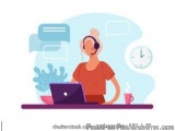 The image shows a person sitting at a desk with a laptop and a cup of coffee in front of them. The person is wearing a headse...