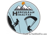 The image is a circular logo with a light blue background. In the center, there is a mountain range with the words "Herculean...