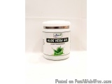 The image is of a jar of Aloe Vera Gel. The jar is white with a silver lid and has a label on it. The label has an image of a...