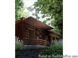 The image is a 3D rendering of a small wooden house in a garden. The house has a sloping roof with a lattice-like design on t...