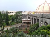 The image shows a beautiful view of a large building with a dome on top. The building appears to be a palace or a palace with...