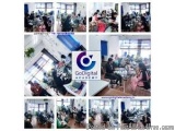 The image is a collage of multiple photographs of a conference room. The photographs are arranged in a grid-like pattern, wit...