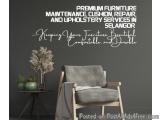The image shows a corner of a room with a gray wall and a wooden floor. On the wall, there is a text that reads "Premium Furn...