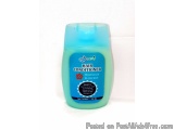 The image is of a blue-colored hair conditioner bottle. The bottle is cylindrical in shape with a flip-top lid. The label on...
