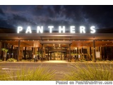 The image shows the entrance of a building with the word "PANTHERS" written in large, white letters above the entrance. The b...