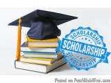 The image shows a stack of books with a blue graduation cap on top. The books are of different sizes and colors, with the top...