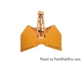 The image shows a yellow-colored excavator bucket with the brand name "GRABBLIFTERS" written on it. The bucket is made of met...