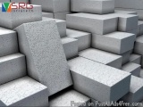 The image shows a stack of gray concrete blocks. The blocks are arranged in a way that they are stacked on top of each other,...