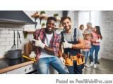 The image shows two young men in a kitchen, both wearing gloves and smiling at the camera. They are standing in front of a st...