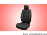 The image shows a black car seat with red stitching on the backrest and armrests. The seat appears to be made of a soft, plus...