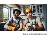 The image shows two young men in a kitchen, both wearing hard hats and overalls. They are both smiling and appear to be happy...