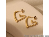 The image shows a pair of gold earrings on a white surface. The earrings are in the shape of a heart, with a curved top and a...