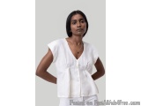 The image shows a young woman wearing a white blouse with a V-neckline and short sleeves. The blouse has a button-down front...