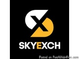 The image is a logo for SkyExch, a company that provides post-all-ads4free.com. The logo is black with a white and yellow col...