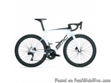 The image is of a white and black bicycle with a black seatpost. The bike has a sleek and modern design with a low step-throu...
