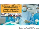 The image shows a group of surgeons performing surgery in an operating room. They are wearing blue surgical gowns, masks, and...