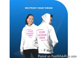 The image shows a young couple wearing white hoodies with pink text on them. They are standing side by side, facing each othe...