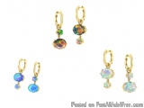 The image shows a set of four pairs of earrings. The earrings are made of gold and have a hook at the top for hanging. Each e...