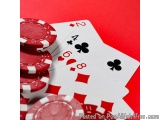 The image shows a pile of red poker chips on a red background. On the left side of the image, there are several red and white...