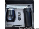 The image shows a black box with a set of items inside. On the left side of the box, there is a black cylindrical object with...