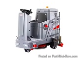 The image shows a floor scrubber dryer, which is a type of cleaning machine used for scrubbing and polishing floors. It is a...