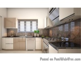The image shows a modern kitchen with a minimalist design. The kitchen has a large island with a black countertop and a stain...