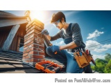 In this image, we can see a young man working on a brick chimney on the roof of a house. He is wearing a blue overalls, a gra...