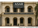 The image is a photograph of the exterior of the Asar Connaught Place by Orion Hotels. The building is a two-story structure...