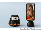 The image shows a black cat-shaped device with an orange arrow pointing towards it. The device is placed on a blue background...