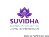 The image is a logo for the Suvidha Rehabilitation Centre. The logo is a purple lotus flower with a blue center. The word "Su...