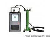 The image shows a green-colored machine with a digital display. The machine has a handle on the top for easy carrying and a p...