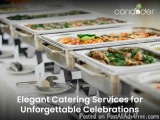 The image shows a long buffet table with multiple trays of food items arranged neatly on it. The trays are made of stainless...