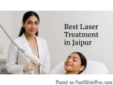 The image shows a young woman receiving a laser treatment in Jaipur, India. She is sitting in a white chair with her eyes clo...