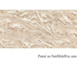 The image is a close-up of a marble surface. The marble has a light beige color with darker brown veins running through it. T...