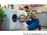In this image, we can see a man in a yellow and blue checkered shirt and blue overalls kneeling on the floor in front of a wa...