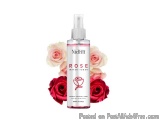 The image is of a bottle of Nidhi Rose Water Toner. The bottle is white with a pink label and a pump dispenser. The label has...