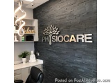 The image shows the interior of a clinic or clinic with a black and white color scheme. On the wall, there is a large sign th...