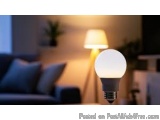 The image shows a living room scene with a couch and a lamp. The lamp is turned on and the light from the lamp is shining on...