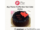The image is of a chocolate cake with two red hearts on top. The cake is on a white plate and is placed on a table. The backg...