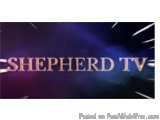 The image is a logo for Shepherd TV. The background is a dark purple color with a gradient effect. In the center of the image...