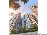 The image shows a group of tall, modern high-rise buildings with multiple floors and balconies. The buildings are surrounded...