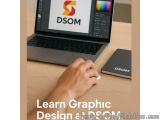 The image shows a laptop with the logo of DSOOM on the screen. The laptop is placed on a wooden desk with a notebook next to...